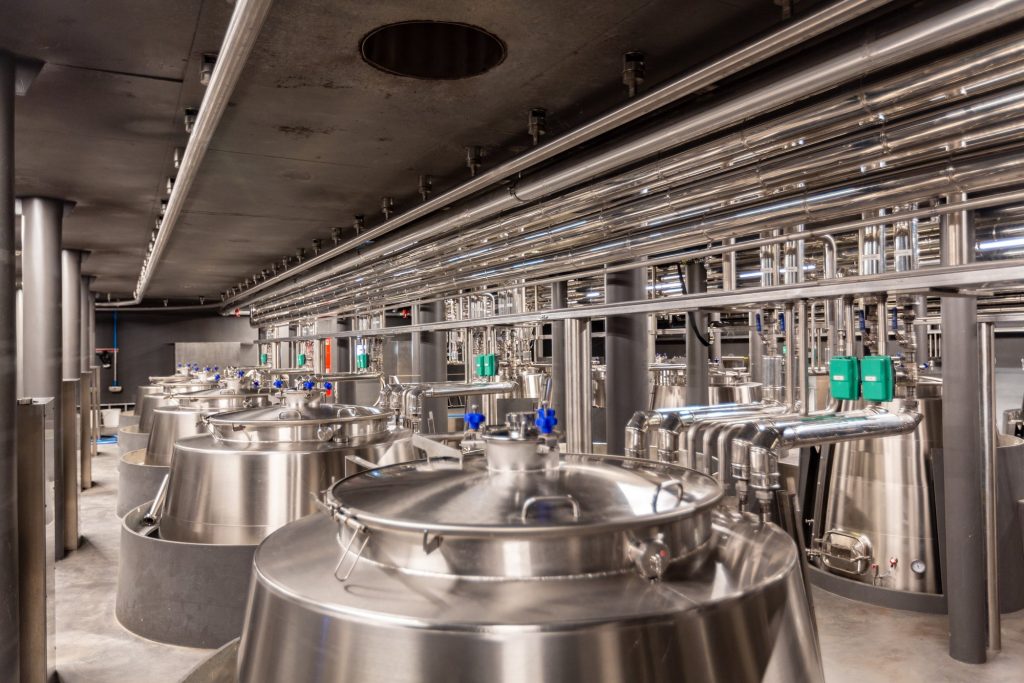 Stainless steel food processing pipeline in a food manufacturing facility.