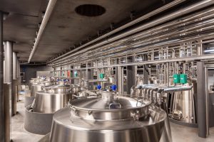 Stainless steel food processing pipeline in a food manufacturing facility.